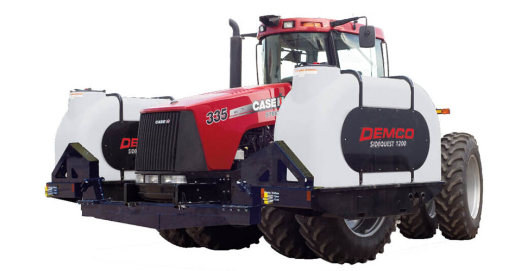 1200 gallon fertilizer tanks mounted on 4WD red tractor