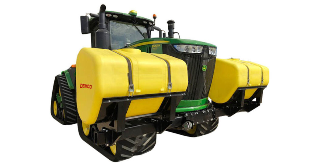 600 gallon fertilizer tanks mounted on green 4WD tractor