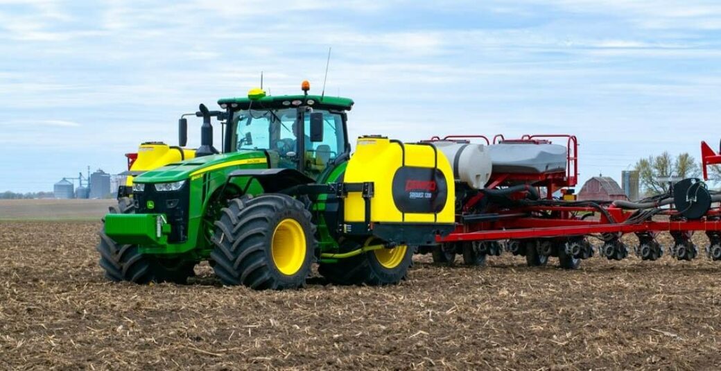 Fertilizer tanks mounted on green tractor