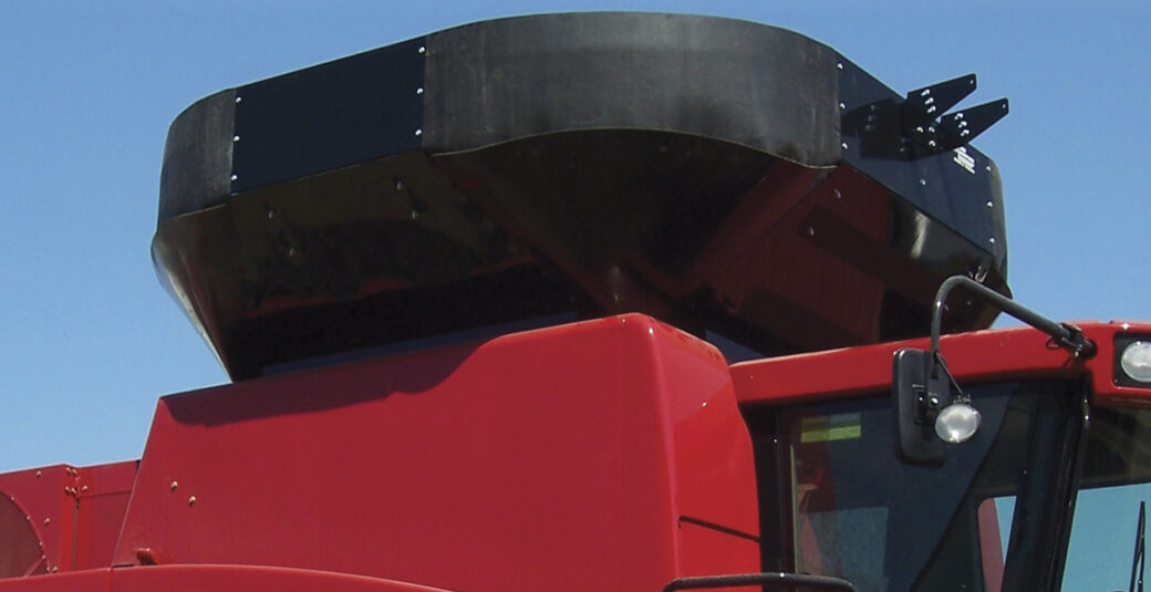 A red combine grain tank extension