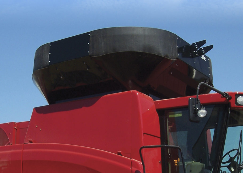 A red combine grain tank extension
